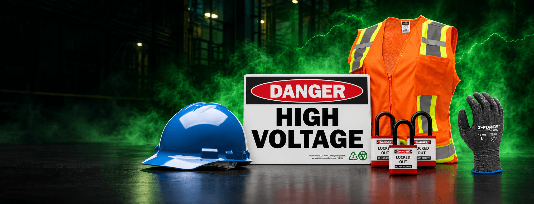 Safety gear including a hard hat, vest, and gloves with a "Danger High Voltage" sign and padlocks in an industrial setting.